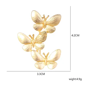 Elegant gold-finished triple butterfly brooch pin with 4.2cm by 3.3cm dimensions