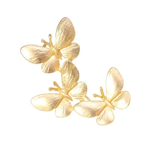 Elegant matte gold alloy brooch featuring three connected butterflies for women suits