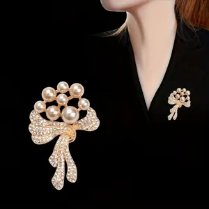 Elegant pearl and rhinestone bow-knot brooch for women jackets and sweaters