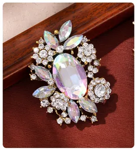 Macro view of vintage iridescent rhinestone brooch with gold alloy setting for women