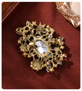 High-quality detailed back view of vintage gold-tone alloy brooch showing pin closure