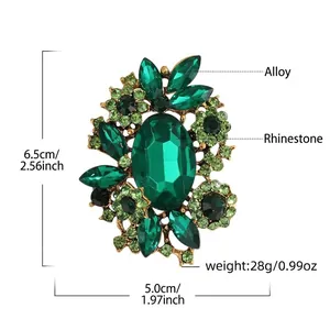 Elegant vintage green glass floral brooch with rhinestone accents and antique alloy frame