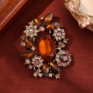 Elegant vintage amber glass crystal brooch with floral rhinestone details for women's fashion