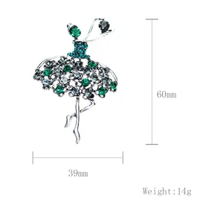 Detailed view of an elegant ballet dancer brooch with green crystals and 60mm height