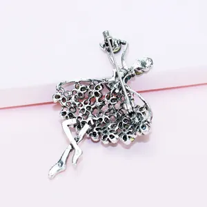 Detailed back view of silver alloy ballet dancer brooch with secure safety pin clasp