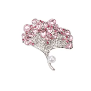 Elegant silver ginkgo leaf brooch featuring pink crystals and a white faux pearl accent
