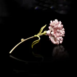 Elegant pink carnation brooch with gold stem and green leaves for women suit accessory.