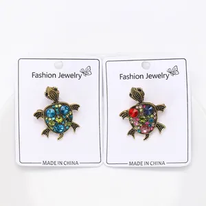 Elegant vintage retro style alloy crystal turtle brooches shown on white display cards