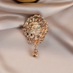 Detailed back view of a vintage gold floral brooch with a secure pin clasp.