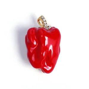 Vibrant red bell pepper brooch with sparkling rhinestone accents on gold-tone bail.