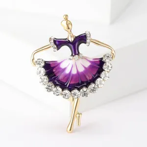 Detailed view of elegant ballerina brooch with purple enamel and sparkling crystals