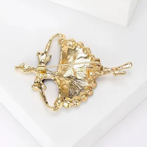 Detailed macro view of the golden ballet dancer brooch back showing a secure pin clasp
