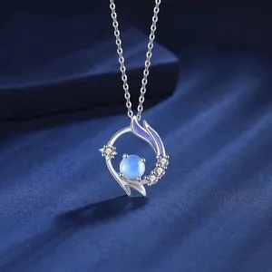 Dreamy silver fishtail necklace with blue gemstone and purple enamel detail for women