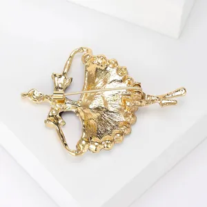 Back view of elegant gold ballerina dancer brooch with a secure safety pin closure