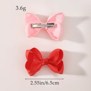 Grosgrain ribbon bow hair clips for children, pink and red bows with measurement details.