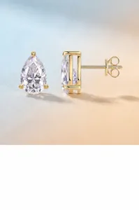 Detail view of pear-cut moissanite earrings in gold-plated 925 sterling silver.