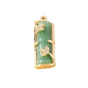 Green imitation jade bamboo pendant with gold metal leaf accents for jewelry making