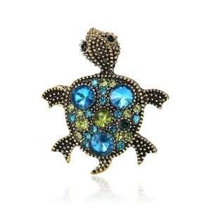 Vintage antique gold alloy turtle brooch pin decorated with blue and green rhinestones