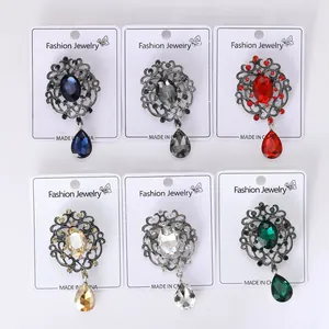 Detail view of vintage crystal brooches in six elegant colors with rhinestone pins