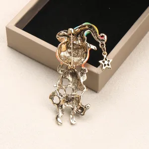 Detailed back view of a vintage Halloween cat and pumpkin hat metal brooch pin