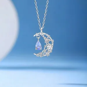 Elegant silver crescent moon and star necklace featuring a dreamy lavender drop stone