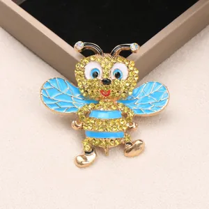 Squisita spilla ape a cartone con strass gialli e ali in smalto blu accessorio