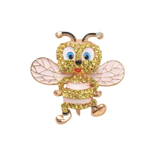 Adorabile spilla a forma di ape con strass gialli e ali in smalto bianco.