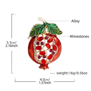 Pomegranate brooch with red rhinestones and green enamel leaves, 5.5cm height