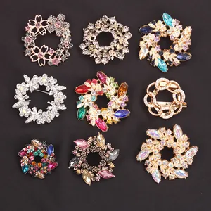 Assorted floral wreath brooches featuring crystals and colorful petals for unisex wear