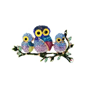 Detailed view of the vibrant enamel owl brooch set with sparkling colorful crystals.