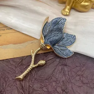 Vintage elegant magnolia flower brooch with blue-grey marble enamel flower petals