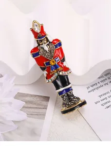 Close-up of a colorful nutcracker guard brooch with sparkling crystal details.