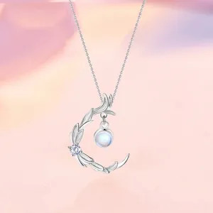 Elegant silver crescent moon pendant necklace with leaf motifs and iridescent moonstone