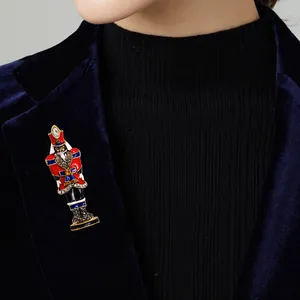 Elegant nutcracker soldier brooch pin featuring colorful enamel and sparkling rhinestones