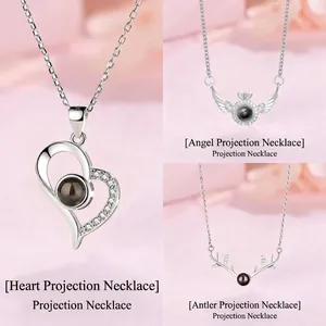 100 languages I love you projection necklace set in heart, angel and antler designs