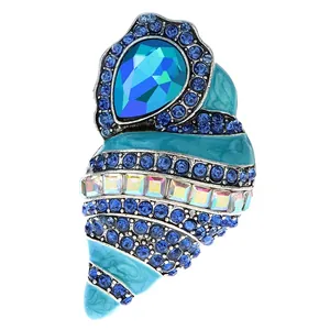 Elegante zeeschelp broche met blauw emaille en fonkelende strass-steentjes details