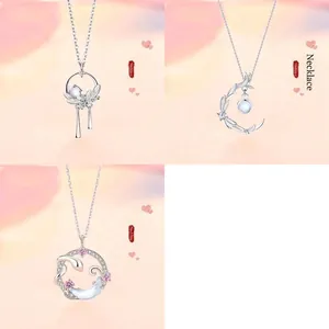 Detailed view of three unique moonstone pendant necklaces presented in a set of three