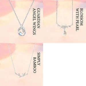 Set of three elegant silver necklaces featuring wing pearl and bamboo design details
