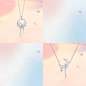 Detailed view of two elegant moonstone necklaces with crescent moon and tassel designs.
