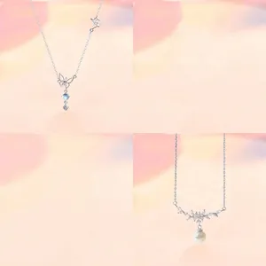 Close-up of butterfly and floral necklaces with elegant pearl and crystal details.