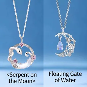 Elegant silver snake and crescent moon pendant necklace with sparkling pink star accents