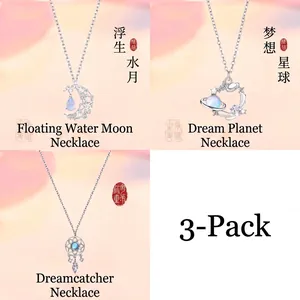 Set of three necklaces featuring moon, planet, and dreamcatcher designs in silver finish