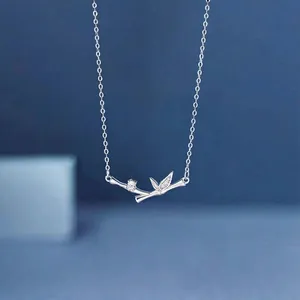 Detailed view of silver bamboo leaf pendant necklace featuring elegant zircon accents.