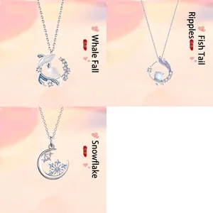 Set of three necklaces featuring whale, fishtail, and snowflake pendants with pearls.