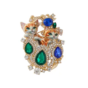 Vintage crystal double cat brooch with colorful emerald and sapphire rhinestones