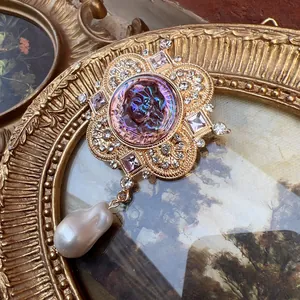 Close-up detail of a vintage Baroque cross brooch with pearls and crystals