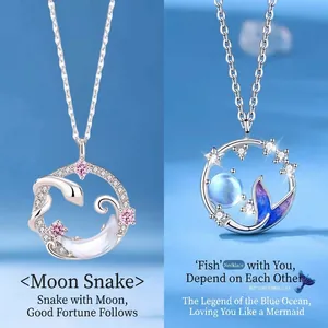 Elegant silver necklaces with crescent moon snake and blue mermaid tail pendants