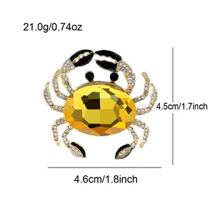 Macro view of crystal crab brooch showing 4.6cm x 4.5cm dimensions and weight