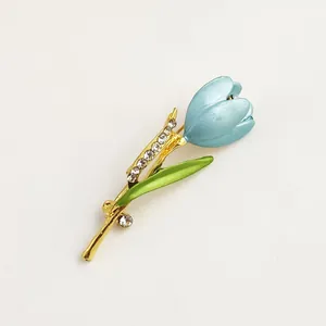 Detail view of an elegant light blue tulip brooch with glittering rhinestone accents