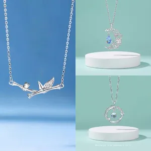 Elegant silver bamboo joint and crescent moon pendant necklaces featuring a minimalist design